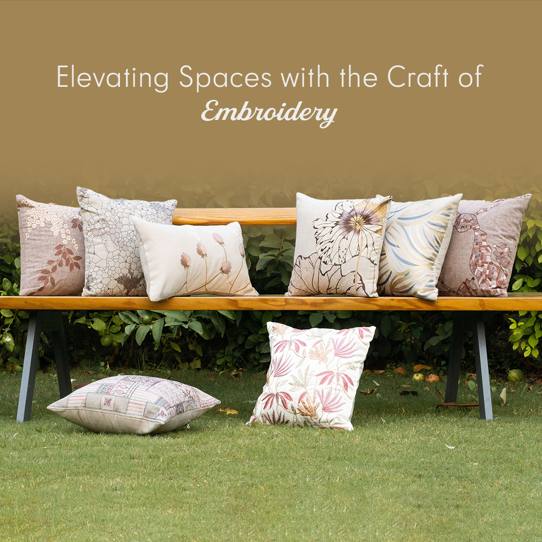 A beautifully arranged cushion of different sizes with luxury embroidered covers on a wooden bench in a garden in home